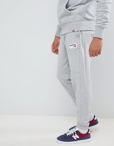 Серые джоггеры с маленьким логотипом New Balance MP83515_AG-Серый