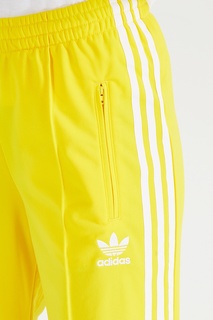 Желтые брюки Firebird Adidas