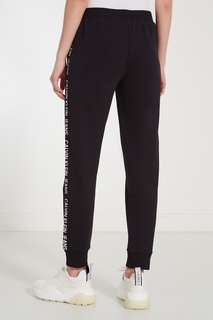 Черные брюки с логотипами Calvin Klein