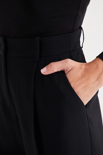 Черные джинсы с надписью Emporio Armani