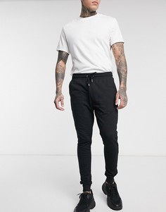 Черные супероблегающие джоггеры ASOS DESIGN-Черный