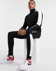 Спортивный костюм с полосой по бокам и принтом \"unrvlld/supply\" ASOS DESIGN-Черный