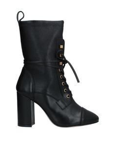 Полусапоги и высокие ботинки Stuart Weitzman