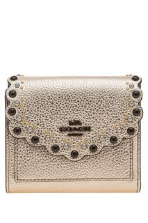 Золотистый кожаный кошелек с металлическим декором Coach