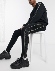 Черные джоггеры скинни с атласными и золотистыми полосами по бокам ASOS DESIGN-Черный