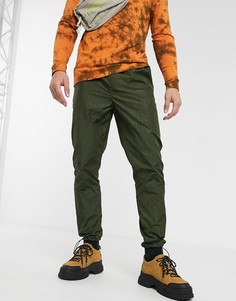 Джоггеры скинни цвета хаки с фиксаторами на манжетах ASOS DESIGN-Зеленый