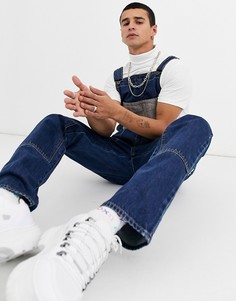 Темно-синий джинсовый комбинезон с карманами на груди ASOS DESIGN