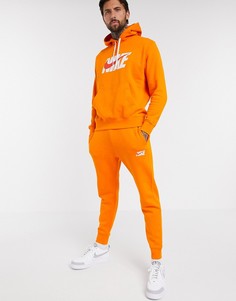 Оранжевый спортивный костюм с худи Nike