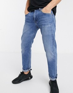 Светлые суженные книзу джинсы Levis 502-Синий Levis®