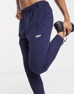 Суженные книзу темно-синие джоггеры со светоотражающими молниями ASOS 4505-Темно-синий