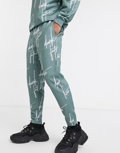 Узкие джоггеры от комплекта со сплошным принтом логотипа ASOS DESIGN-Синий