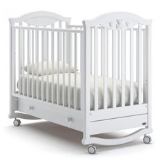 Кроватка Nuovita Lusso (колесо) (качалка), на полозьях белый