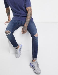 Темные супероблегающие джинсы с рваными коленями ASOS DESIGN-Синий