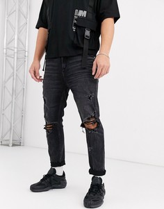 Рваные суженные книзу джинсы черного цвета ASOS DESIGN-Черный