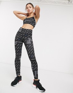 Черные леггинсы со сплошным принтом логотипа Reebok Training-Черный