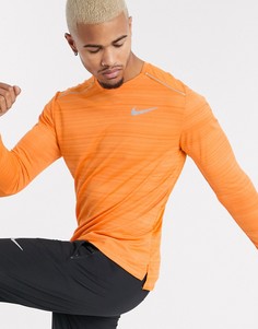 Оранжевый лонгслив Nike Running Miler