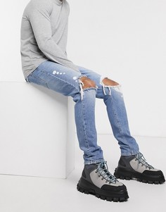 Синие джинсы заниженного кроя с рваной отделкой ASOS DESIGN-Синий