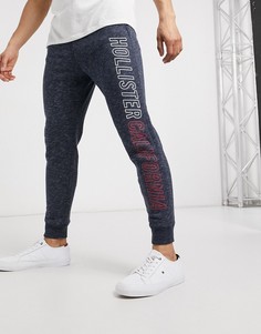 Джоггеры скинни с принтом Hollister-Темно-синий