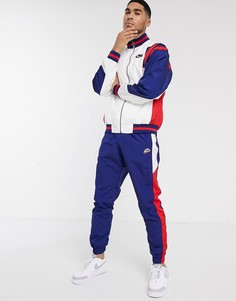 Темно-синие тканые джоггеры с манжетами Nike Heritage-Темно-синий