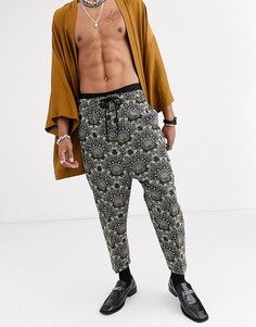 Суженные книзу брюки заниженного кроя с цветочным рисунком ASOS DESIGN-Зеленый