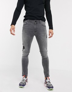 Черные выбеленные джинсы стретч с напылением и состаренной отделкой ASOS DESIGN-Черный