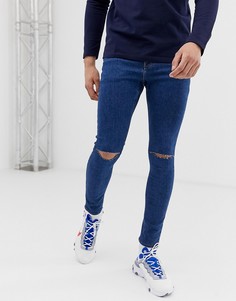 Синие джинсы стретч с напылением и рваными коленями ASOS DESIGN-Синий