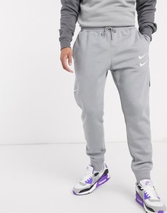 Серые джоггеры с манжетами и логотипом-галочкой Nike-Серый