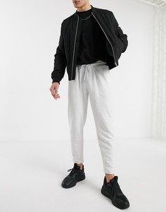 Белые меланжевые джоггеры из органического хлопка с защипами ASOS DESIGN-Белый