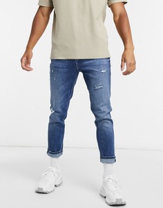 Суженные книзу синие потертые джинсы ASOS DESIGN-Синий