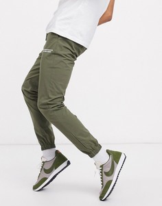 Нейлоновые брюки скинни с текстовым принтом ASOS DESIGN-Зеленый