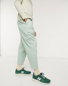 Зеленые брюки заниженного кроя ASOS DESIGN-Зеленый