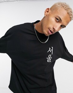 Черный свободный лонгслив с принтом на груди ASOS DESIGN