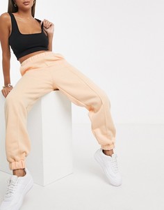 Джоггеры в стиле oversized абрикосового цвета ASOS DESIGN-Оранжевый