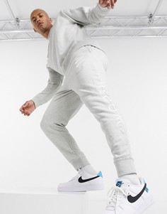 Серые джоггеры с манжетами и логотипом в виде галочки Nike-Серый