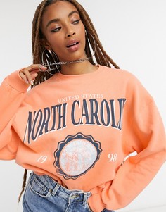 Оранжевый свитшот в стиле oversized с принтом "North Carolina" Bershka