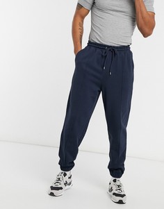 Темно-синие oversized-джоггеры из пике с защипами ASOS DESIGN-Темно-синий