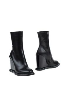 Полусапоги и высокие ботинки Jil Sander