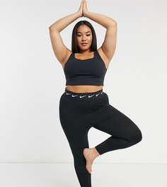 Черный укороченный бюстгальтер Nike Yoga Plus Luxe