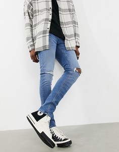 Выбеленные рваные джинсы скинни из коллекции ответственной моды ASOS DESIGN-Синий