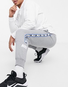 Серые джоггеры с манжетами и логотипом Nike Repeat Pack-Серый