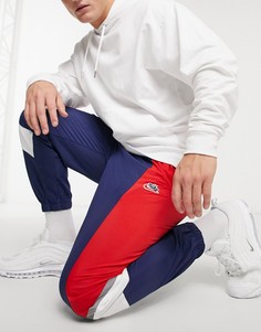 Тканевые джоггеры с манжетами в темно-синем и красном цветах Nike Heritage Essentials Windrunner-Темно-синий