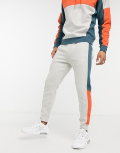 Светло-бежевые джоггеры в стиле колор блок с манжетами Nike Club-Светло-бежевый