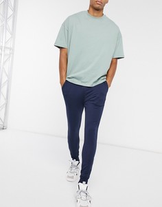 Темно-синие супероблегающие джоггеры ASOS DESIGN-Темно-синий