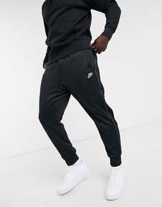 Черные джоггеры с манжетами и отделкой фирменной лентой Nike Repeat Pack-Черный