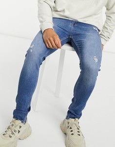 Темно-голубые выбеленные джинсы скинни с рваной отделкой ASOS DESIGN-Голубой