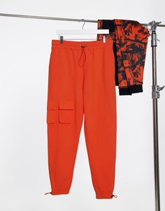 Ярко-оранжевые суженные книзу джоггеры от комплекта с флисовой изнаночной стороной и нейлоновыми карманами ASOS DESIGN-Оранжевый