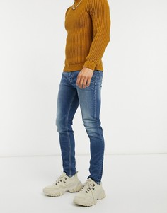 Темно-синие зауженные джинсы с выбеленным эффектом ASOS DESIGN-Голубой