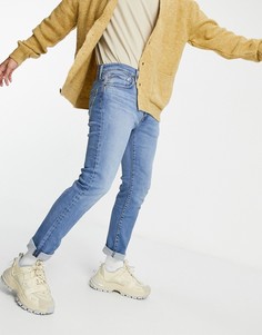 Светло-голубые выбеленные суженные книзу джинсы стандартного кроя Levis 502-Синий Levis®