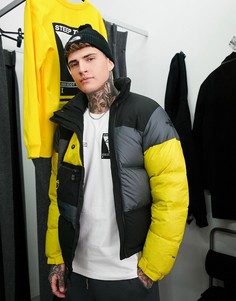 Серый пуховик The North Face Steep Tech