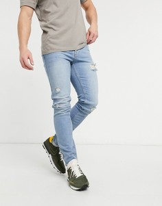 Светлые облегающие джинсы с рваной отделкой ASOS DESIGN-Голубой